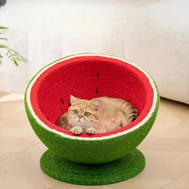 A cat lying down in a cute cat scratching post designed to look like a watermelon, providing a cozy space for lounging and scratching.