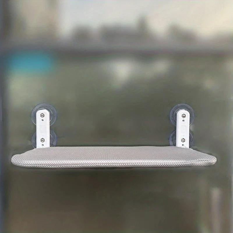 DIY Cat Window Perch with a grey cushion, offering a safe and secure resting spot for cats while they enjoy the view.