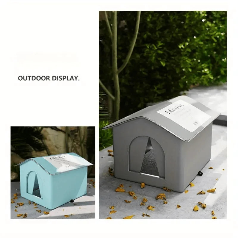 Two small, house-shaped pet shelters displayed outdoors. One is blue, and the other is gray, both featuring an arched entrance and a pitched roof.