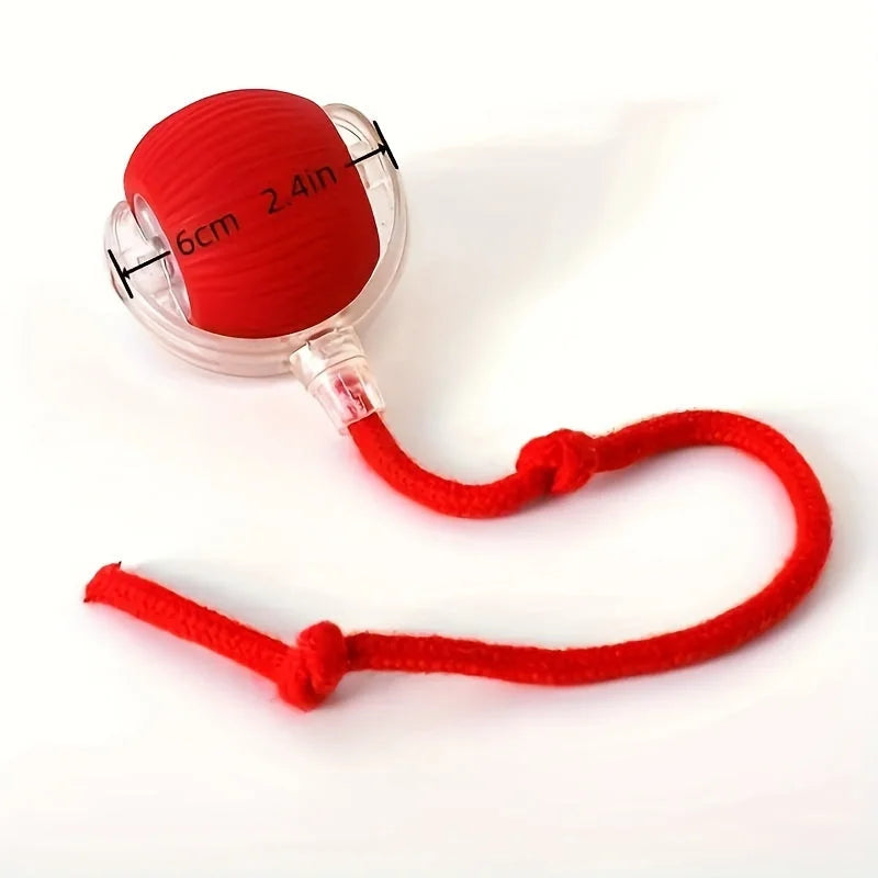 Red cat rolling ball toy with rope, showing its 6cm size