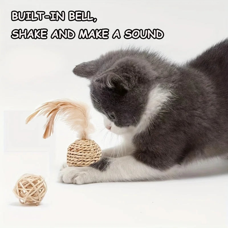 A cat playing with a woven cat scratch ball toy that has a feather and built-in bell making sound.
