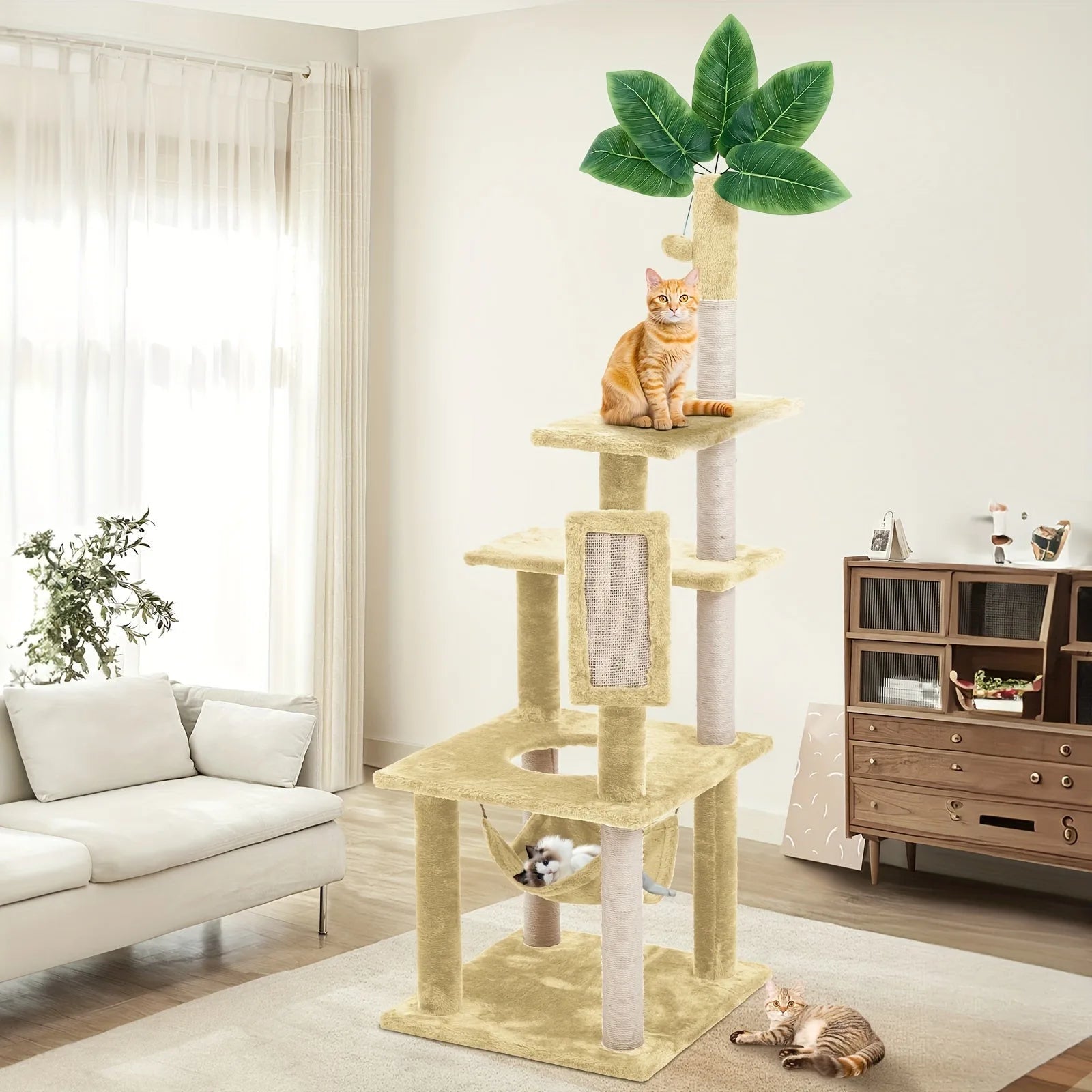 "Beige cat tower for large cats with relaxing platforms, a hammock, and a decorative leafy top."