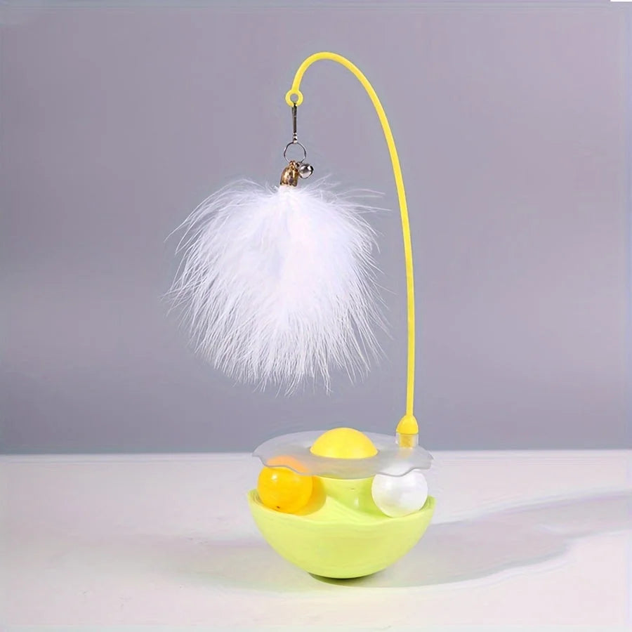 A cat playing with a yellow cat toy feather wand as it swings, with motion blur showing its movement.