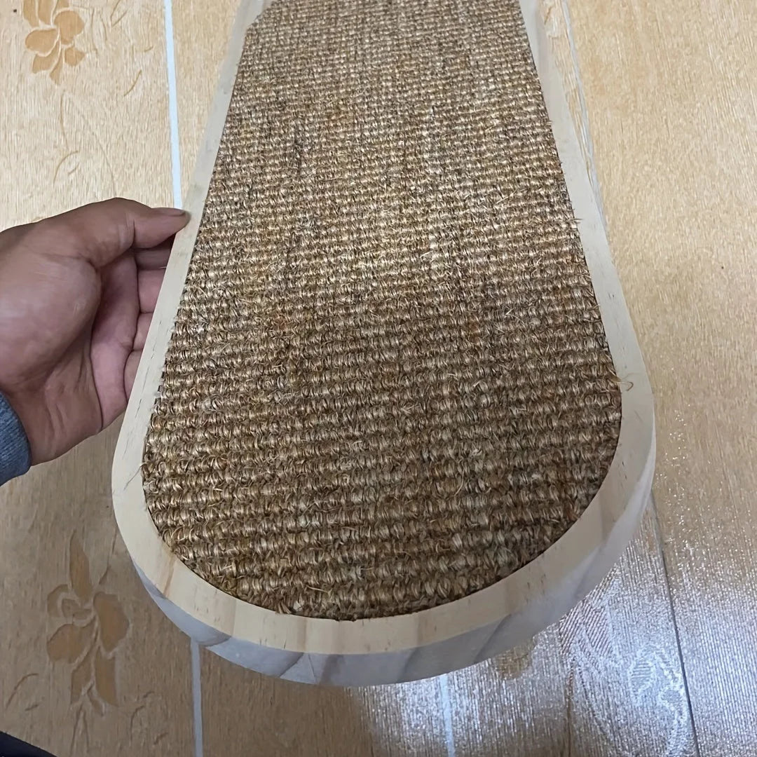 Close-up of a person holding a cat wall scratching post showing the sturdy sisal scratching surface and wooden frame.