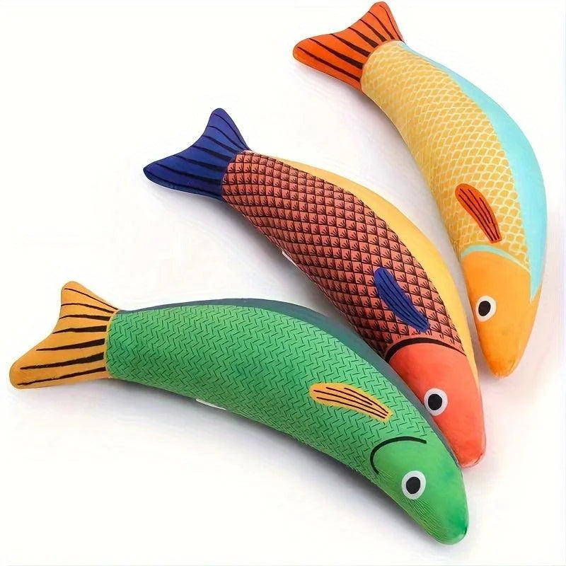 Top view of green, red, and yellow fishing toys for cats arranged on a white background.