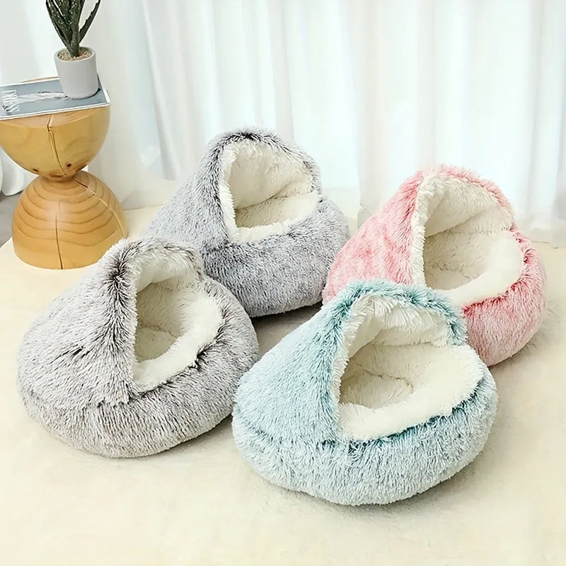 A collection of Furb Cat Beds in multiple colors, including gray, pink, and blue, showcasing variety and style.