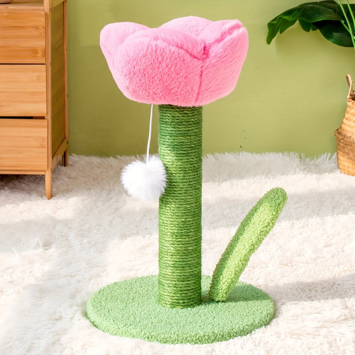 Side angle view of a DIY cat scratching post featuring a pink flower bed and attached toy.