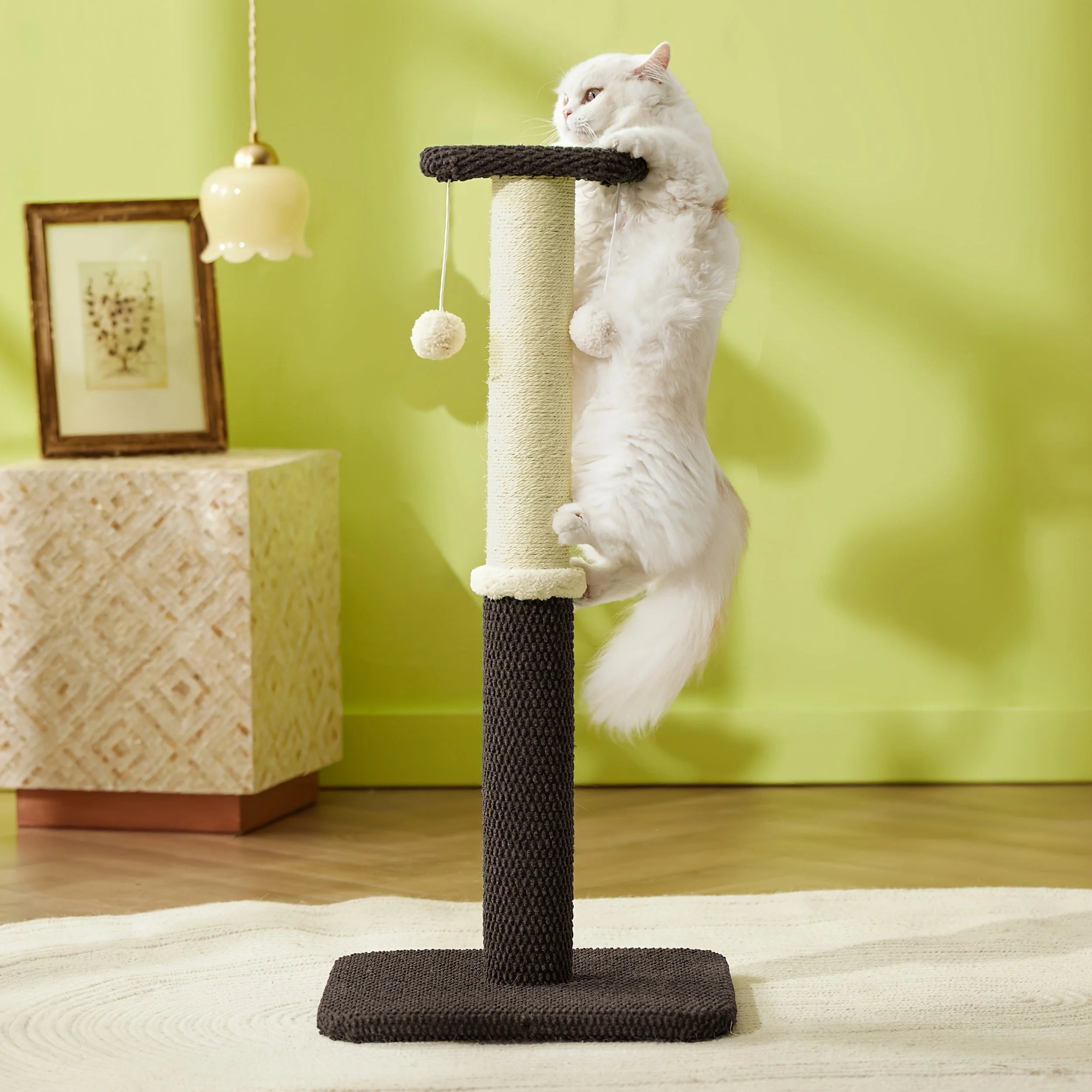 Cat climbing to the top of a tall brown cat scratch post, designed to encourage climbing and scratching instincts.