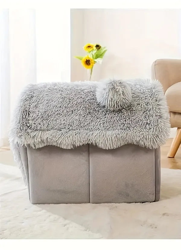 Top view of a grey covered cat bed with a fluffy roof and soft material.
