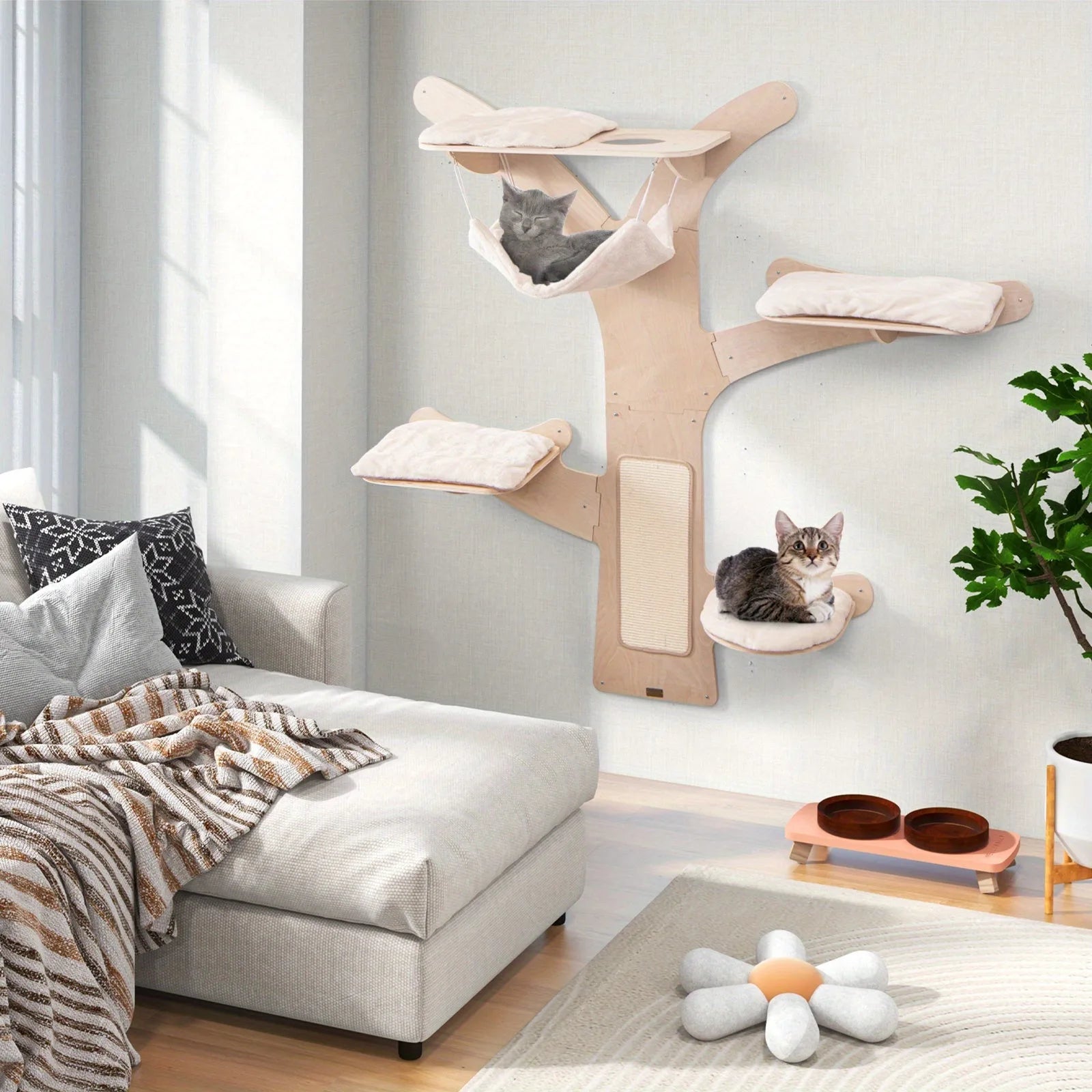 "Wall-mounted cat tree in a living room with pets lounging and playing, showcasing its elegant design and multifunctional use for cat owners."