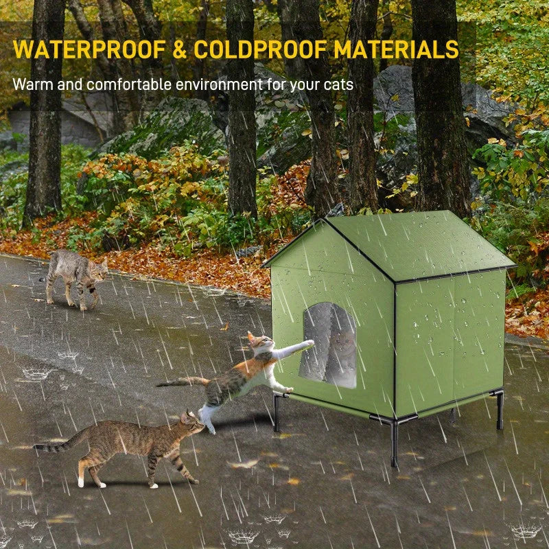 A green heated outdoor house for cats, made with waterproof Oxford cloth and raised to keep moisture out.