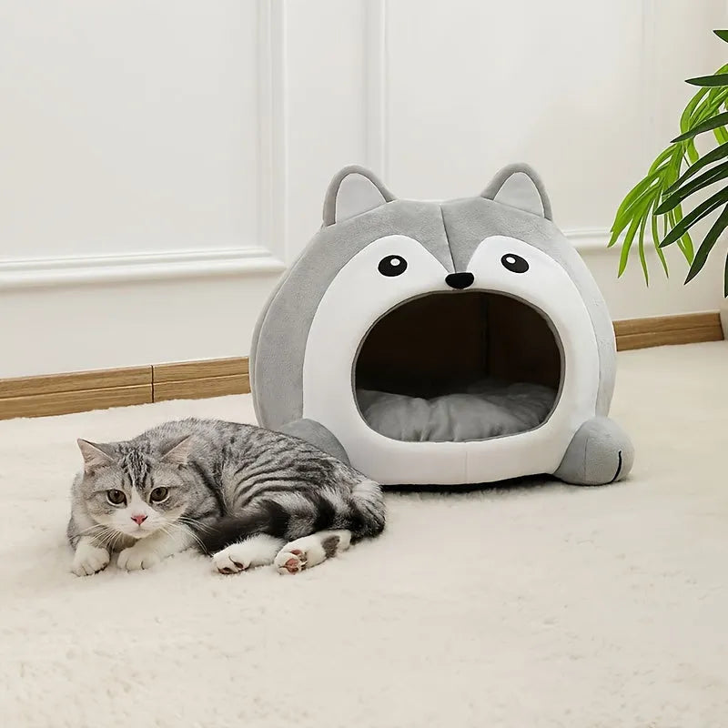 Cat resting beside a cozy grey animal-shaped bed, perfect for enhancing any room decor