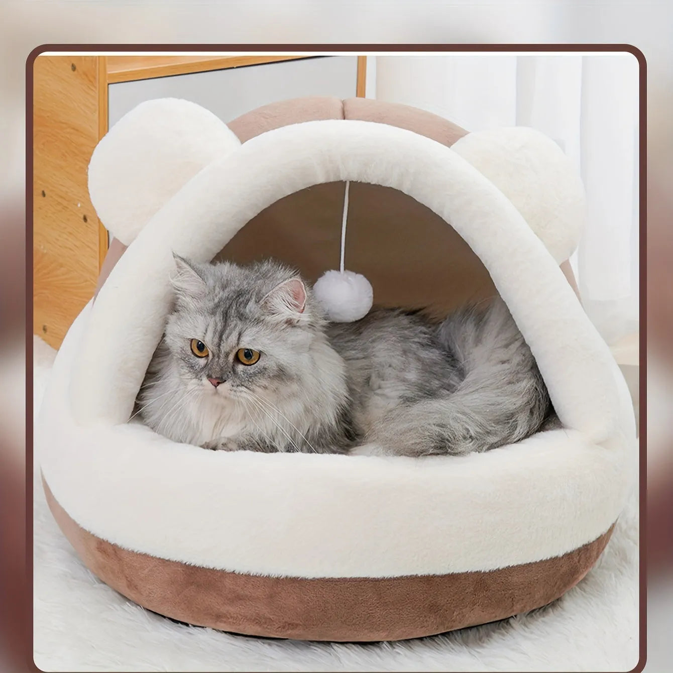 Best rated cat bed suitable for both cats and small dogs, featuring a cozy brown dome with fluffy lining and a hanging toy