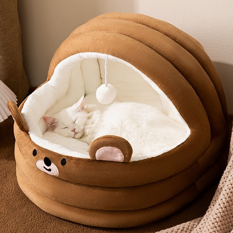 White cat relaxing inside a brown heated cat bed for indoor spaces, featuring a soft interior and a cozy, warm design.