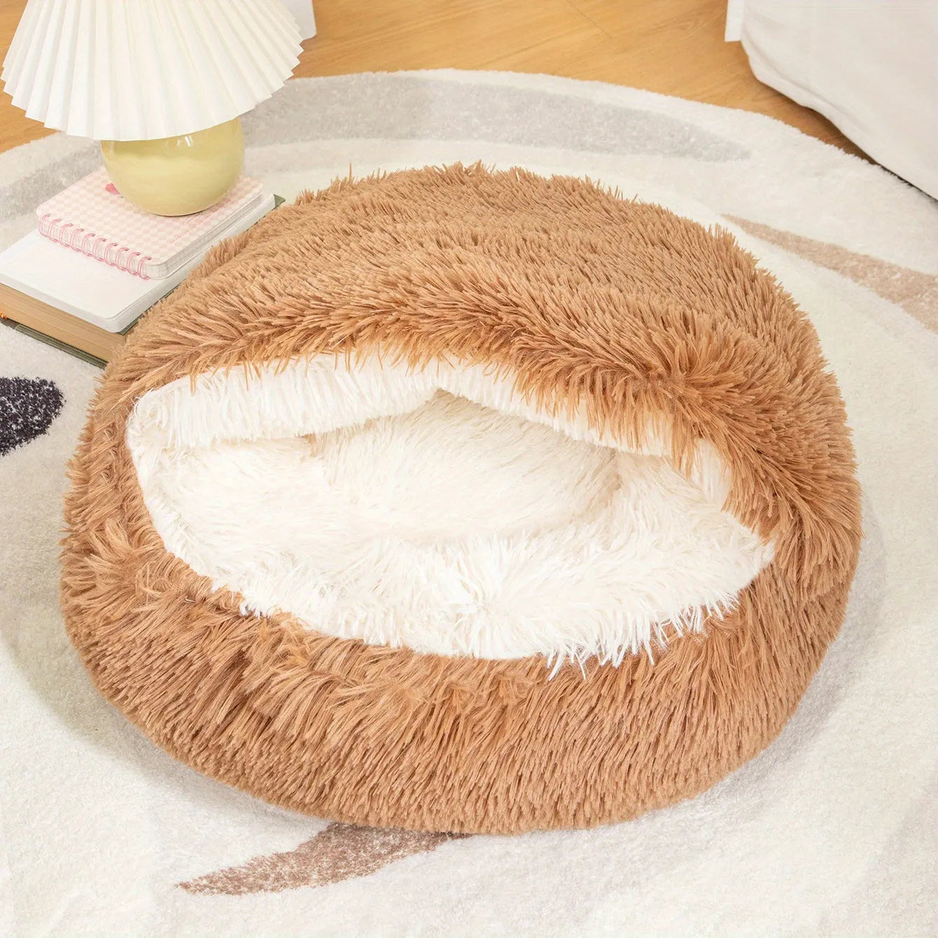 A warm and fluffy brown self-heating cat bed, ideal for providing comfort and security for pets.