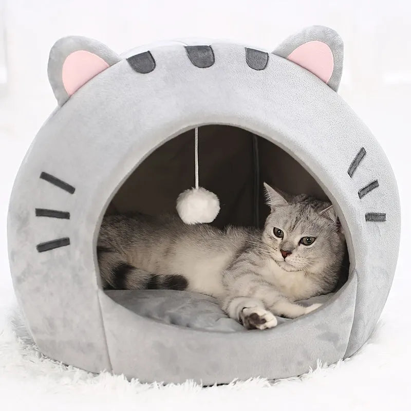 Cat resting inside a premium gray cat bed warmer, designed for comfort and style.