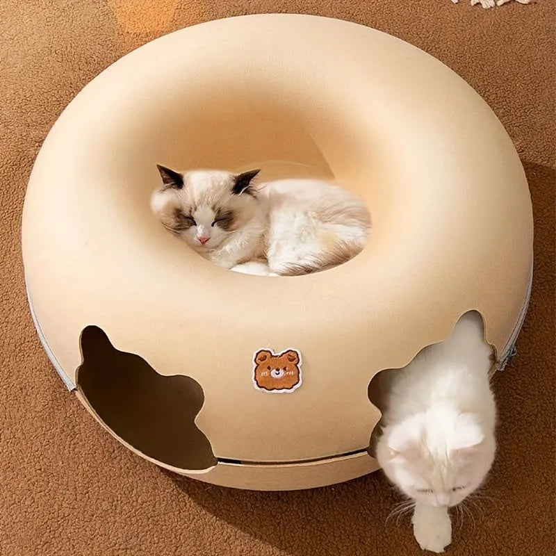 Top view of a cat comfortably sleeping on the circular cat tunnel bed, showcasing its plush and soft design.