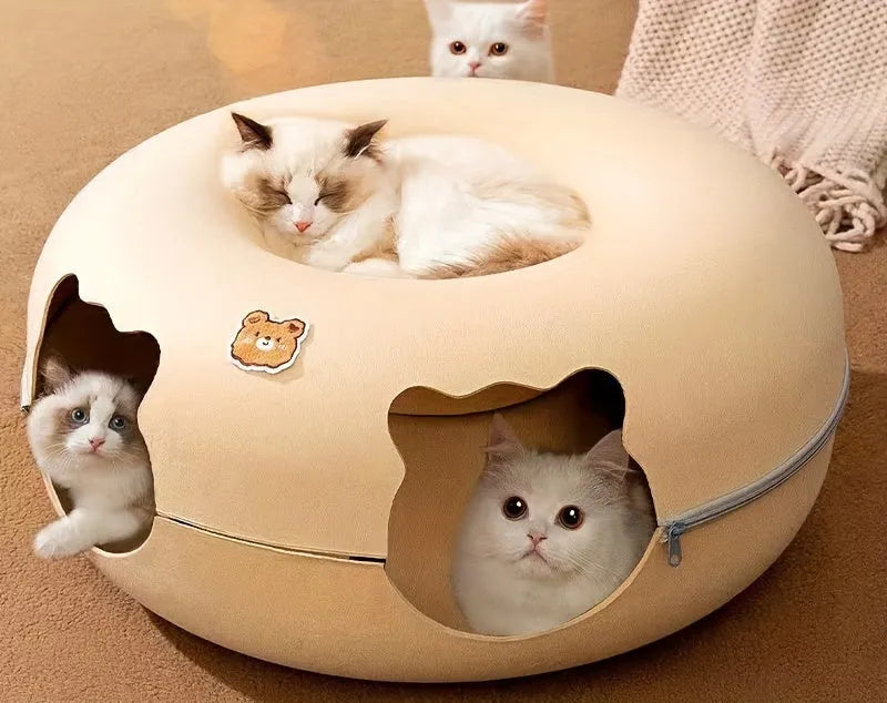 A beige cat tunnel bed with multiple cats enjoying the cozy interiors and the spacious top platform.