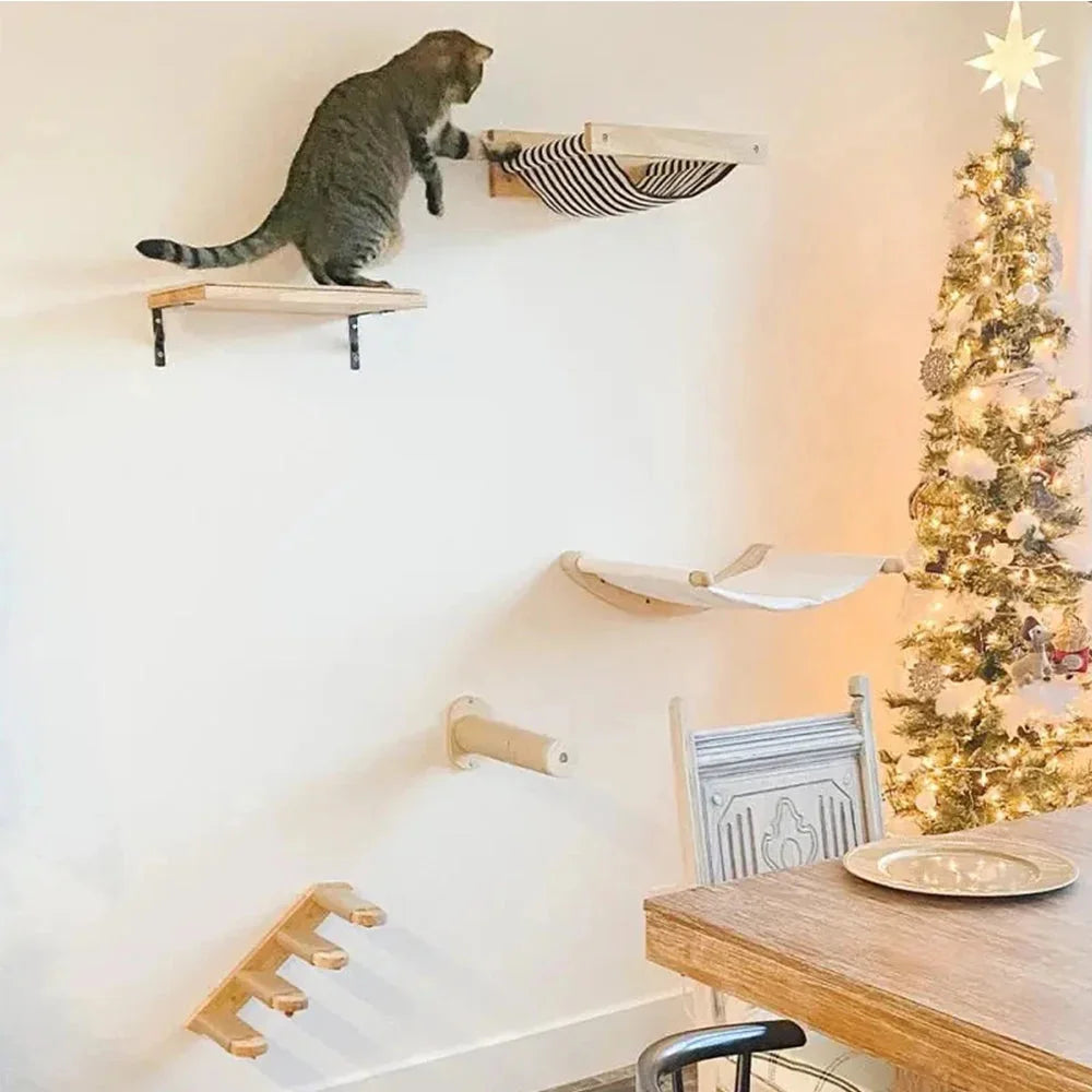 Cat wall climbing system featuring platforms, hammocks, and a festive Christmas setup.