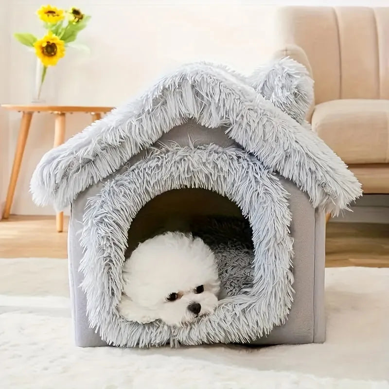 Small dog lying comfortably in a grey covered cat bed with a soft, fluffy design.