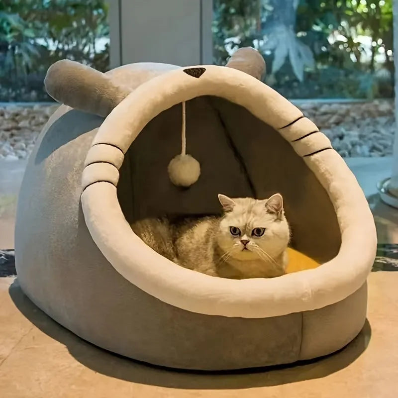 An enclosed cat bed featuring a round opening, soft material, and a plush interior, perfect for cats.