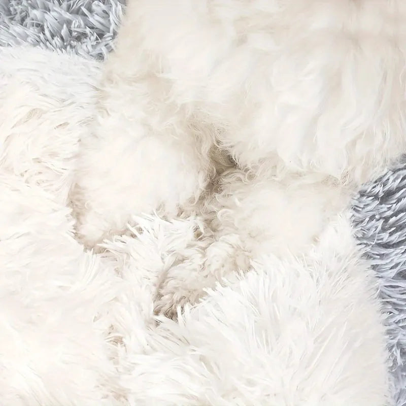 Close-up of soft faux fur material used in a self-heating cat bed, showing plush comfort for pets.