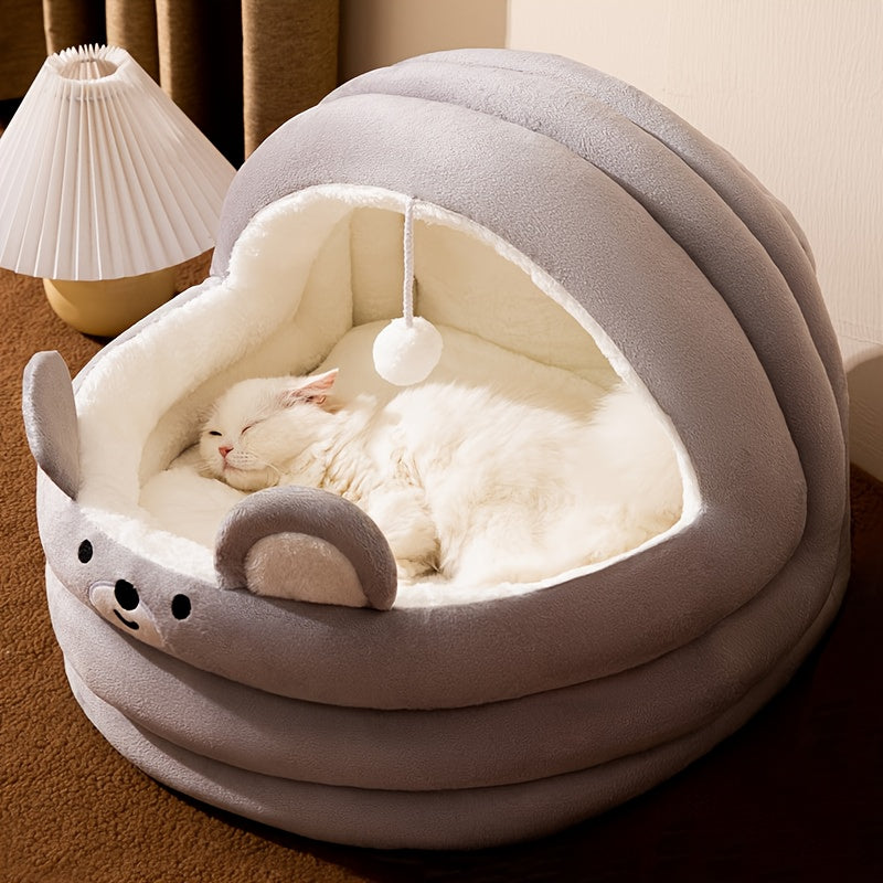 White cat comfortably resting in a gray heated cat bed designed for indoor use, with a warm and inviting structure perfect for pets