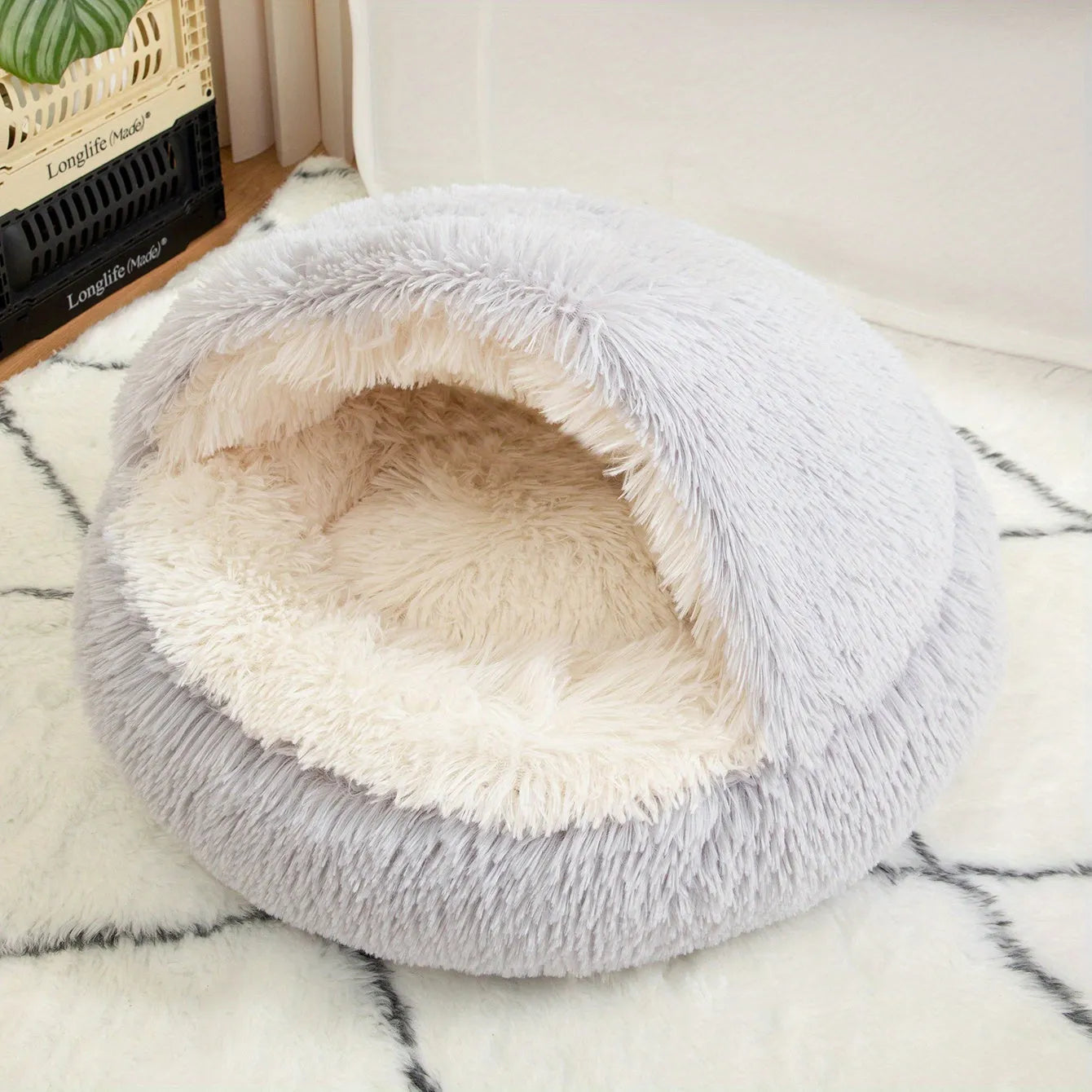 A stylish gray self-heating cat bed with a half-covered design and soft faux fur interior.