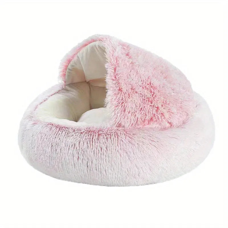 A luxurious pink cat bed with soft fur, ideal for a comfortable and stylish resting space.