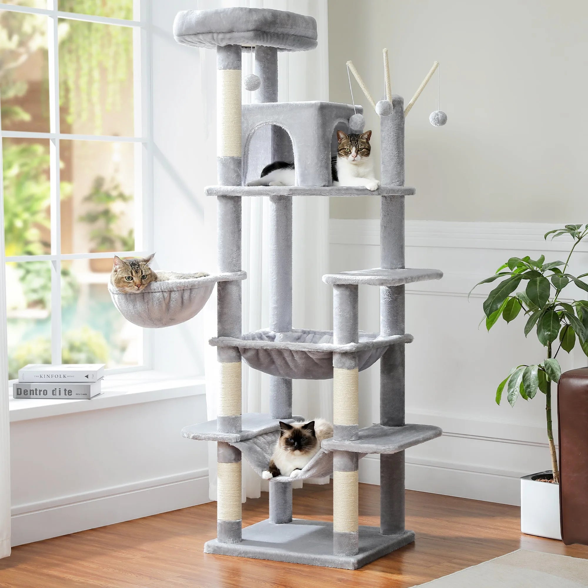 Grey multi-level cat condo for large cats, designed for relaxation and play with spacious hammocks and perches.