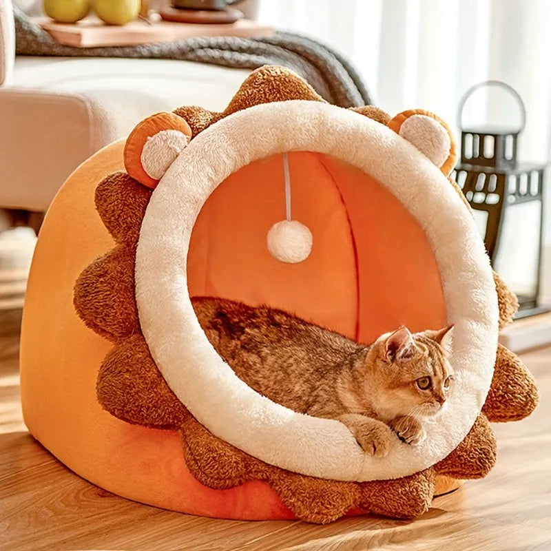 Cat lying inside a cozy heated cat bed shaped like a lion