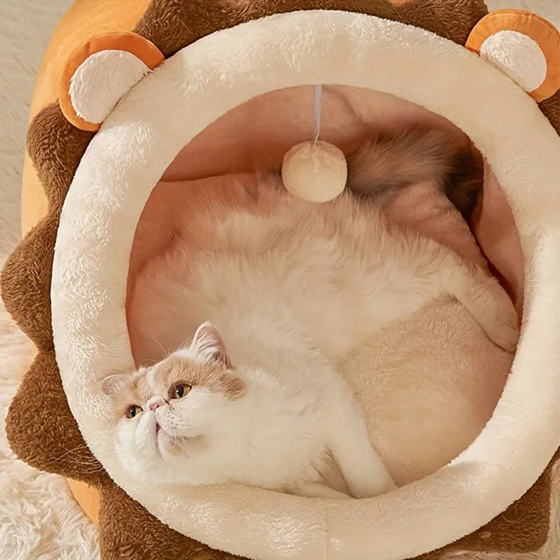 Cat relaxing in a lion-shaped heated cat bed, looking comfortable