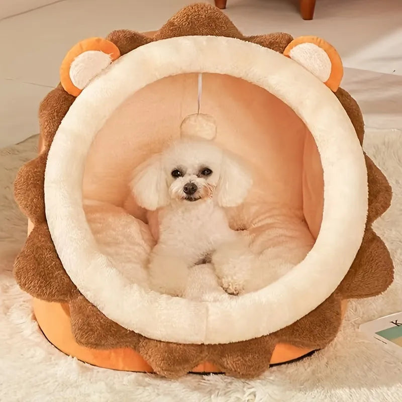 Small dog comfortably sitting inside a lion-themed heated cat bed.