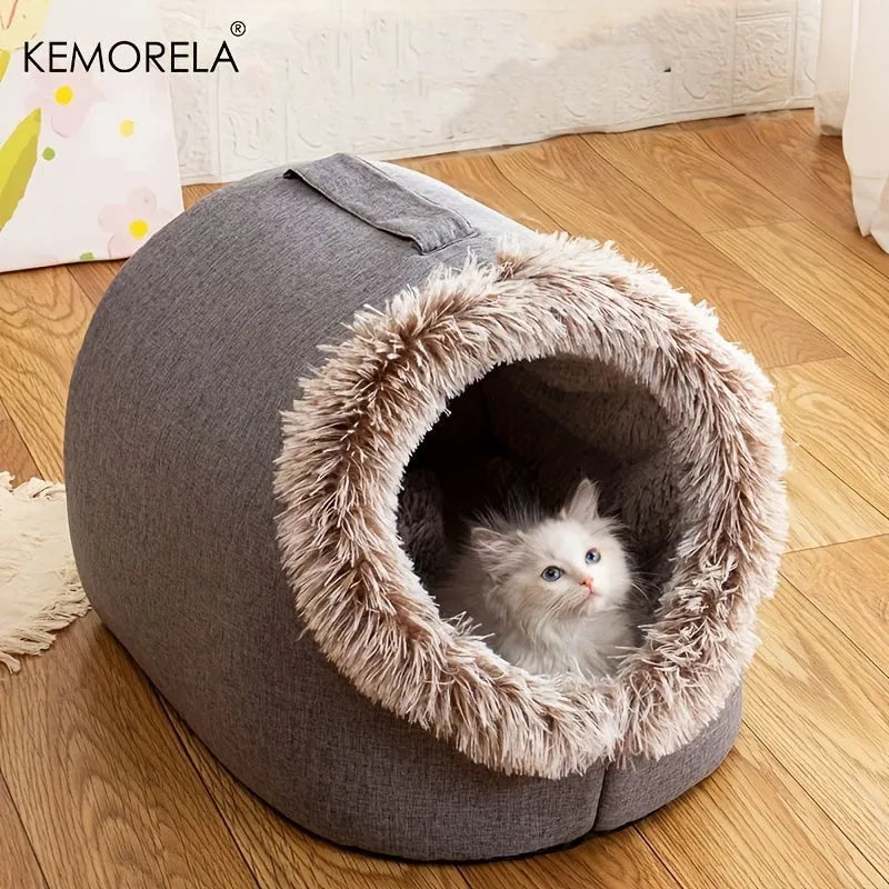 Cozy heated cat bed with a fluffy kitten resting inside, perfect for warmth and comfort.