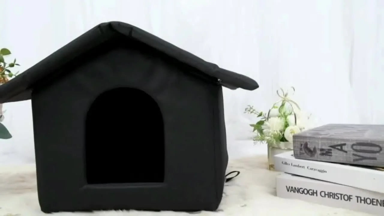 Stylish black insulated cat house for winter with a cozy design for pets.