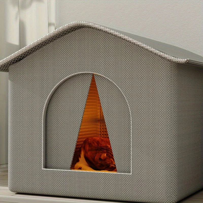 Fully insulated indoor cat house with temperature-locking features for added warmth.