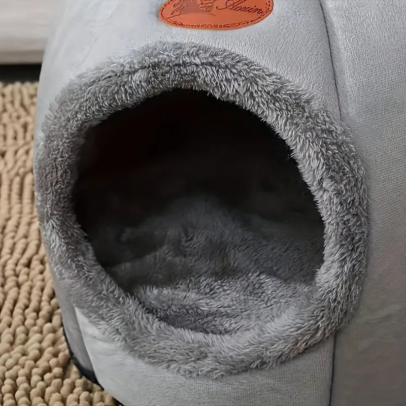 Close-up view of the soft, plush interior of an indoor heated cat bed, highlighting its comfort.