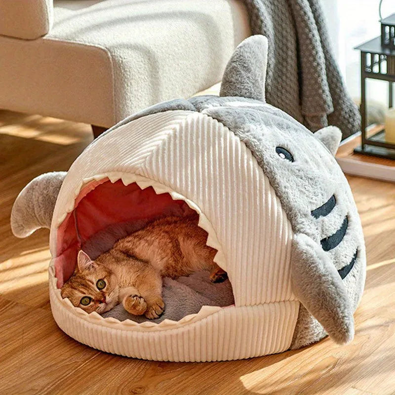 Cozy large cat bed in shark design, offering a safe and warm space for pets to rest.