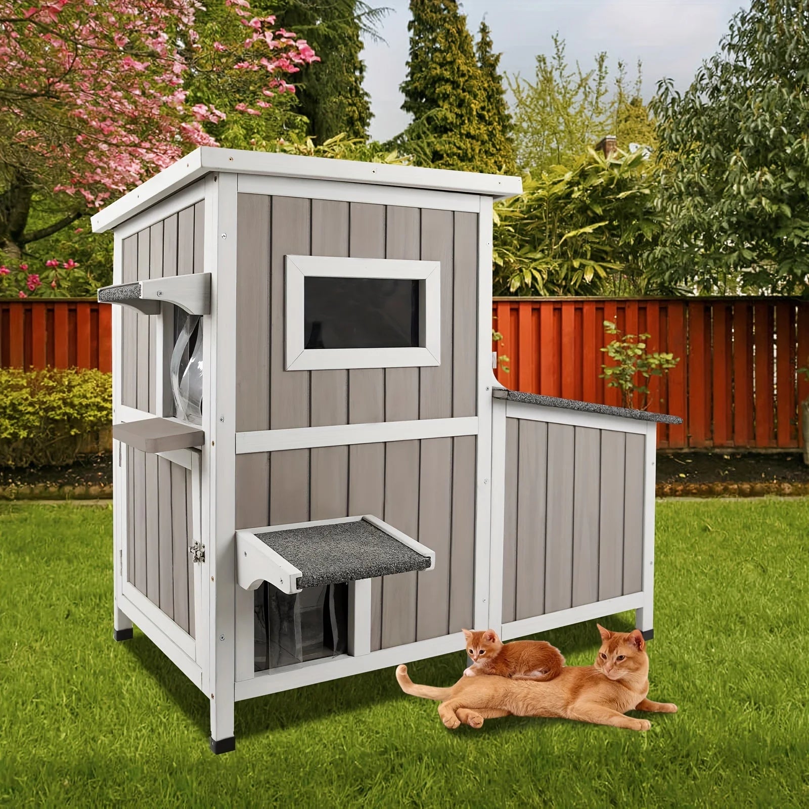 Outdoor cat house for feral cats in a beautiful garden setting, offering a comfortable resting space