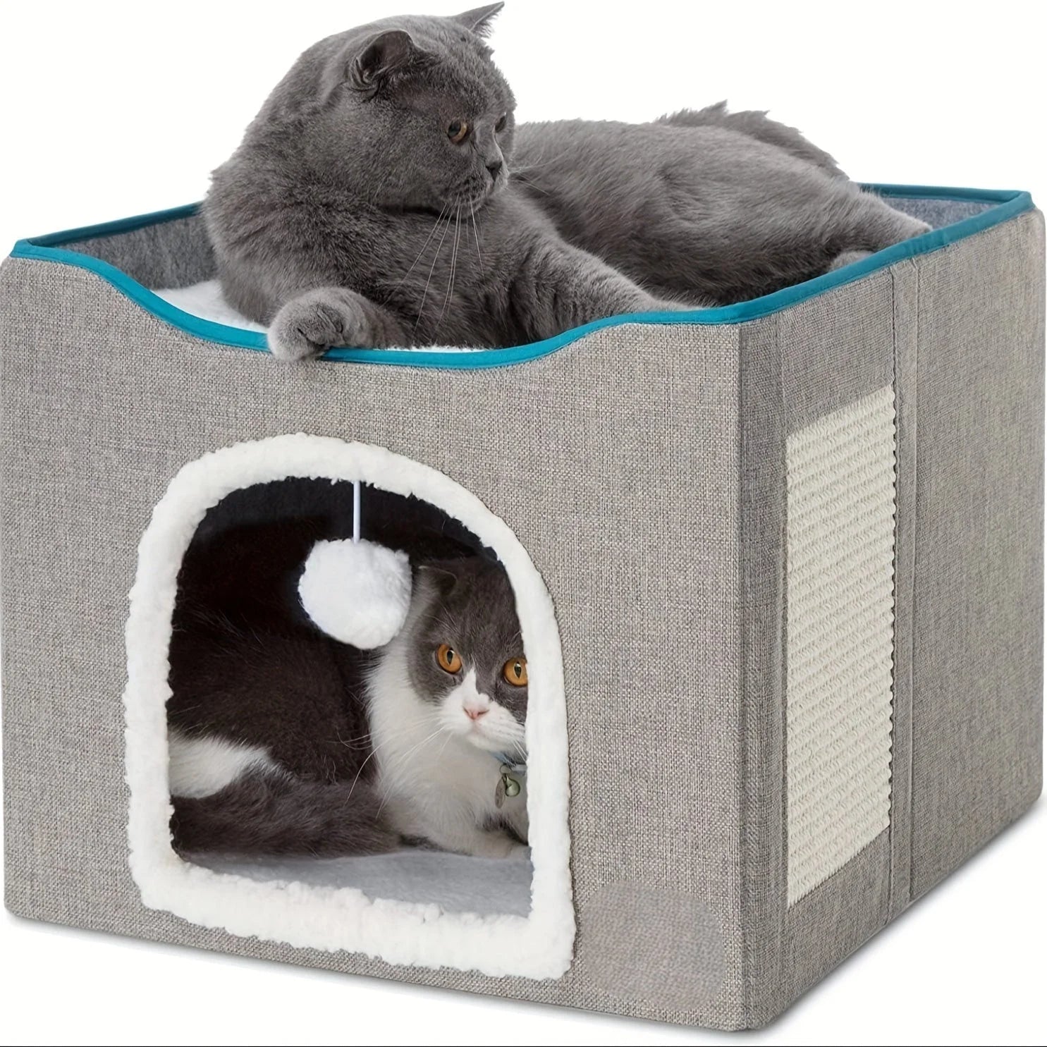 Two cats relaxing in a modern outdoor cat house with heat, showcasing a dual-level design for added comfort.