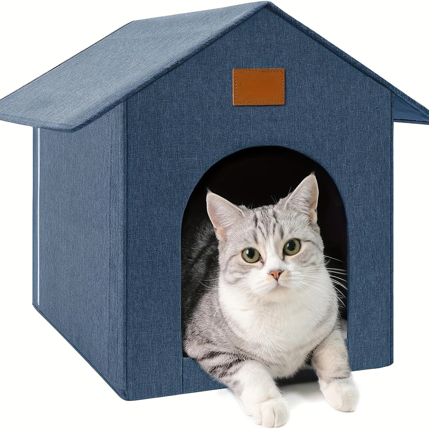 A modern cube-style outdoor cat house with heat, featuring a plush interior, scratching panel, and playful hanging toy