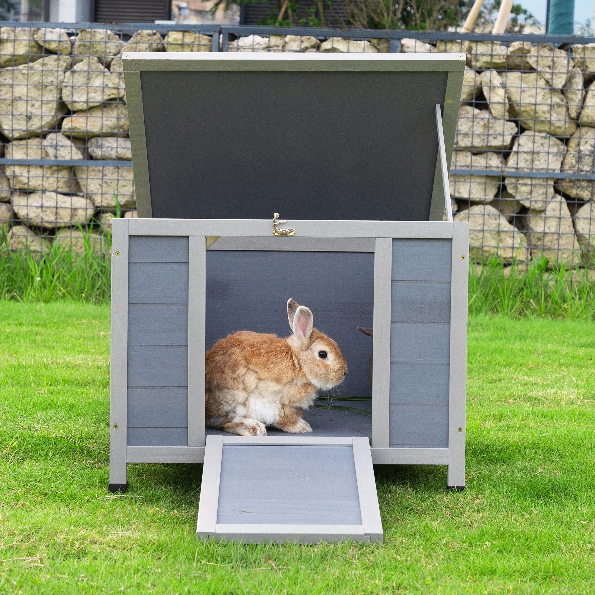 Outdoor insulated cat house with a liftable roof for easy cleaning and access, featuring a bunny inside