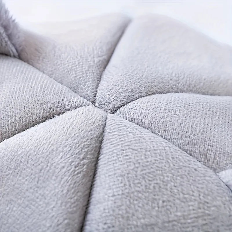 Close-up of the soft and plush cushion from an indoor heated cat bed for maximum comfort.