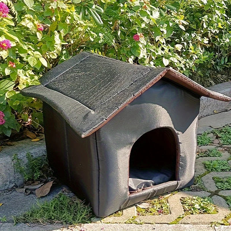 Side view of an outdoor shelter for stray cats, showcasing its sturdy and protective design