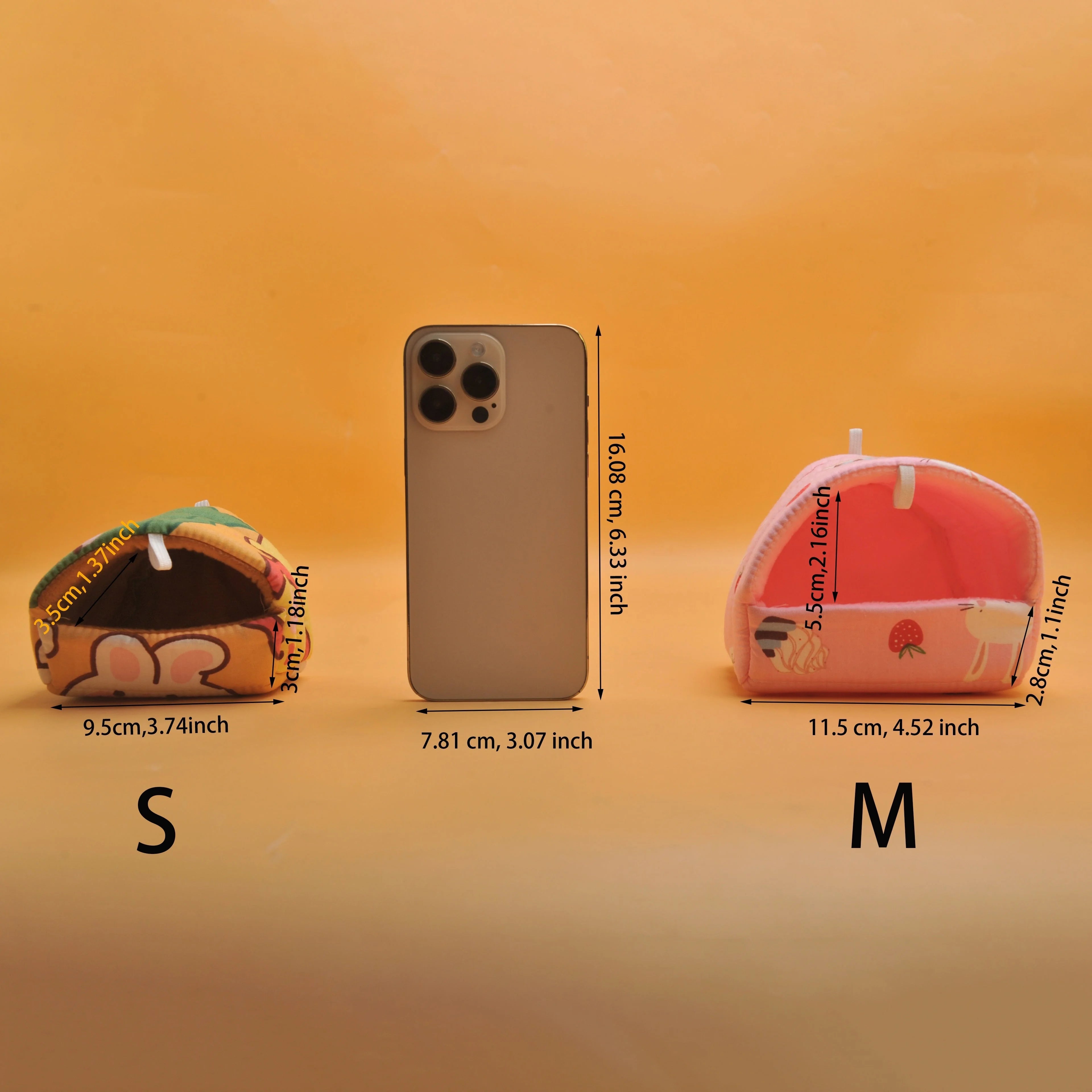 Two plush taco-shaped items in sizes S and M are displayed on either side of a smartphone for scale.