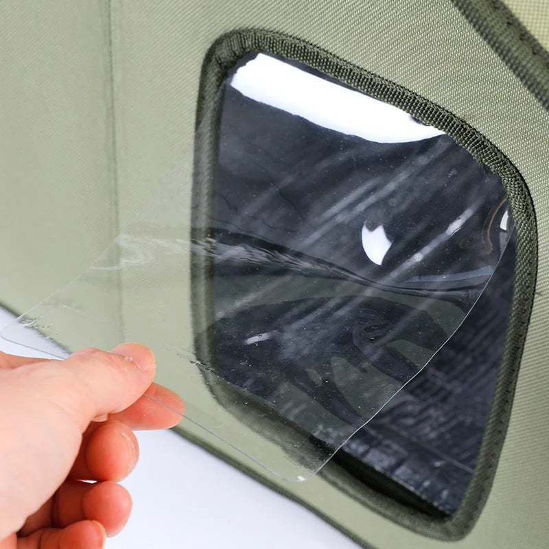 Close-up of the transparent window of the stray cat house, showing flexibility and durability