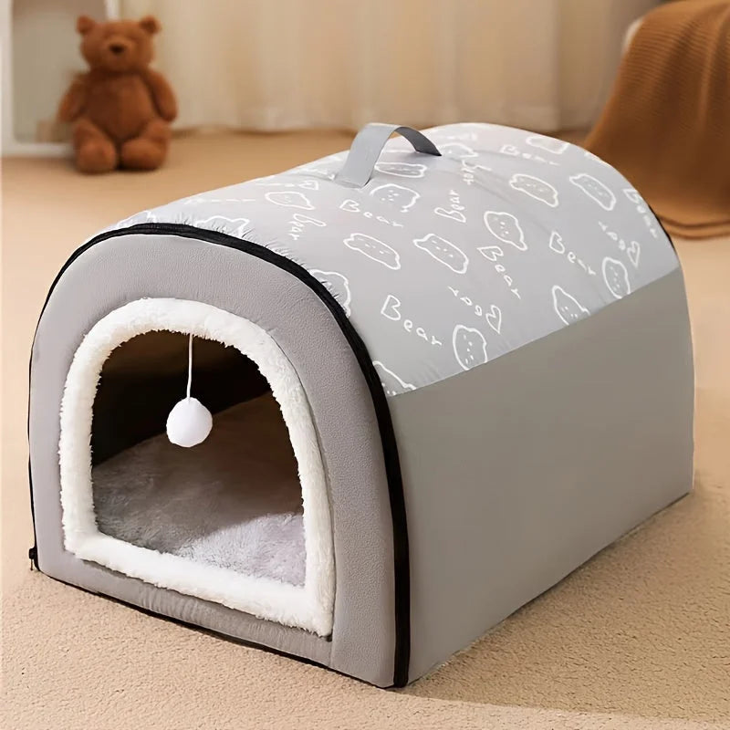 Stylish grey heated cat house with a soft fleece interior, ideal for keeping cats warm during winter.