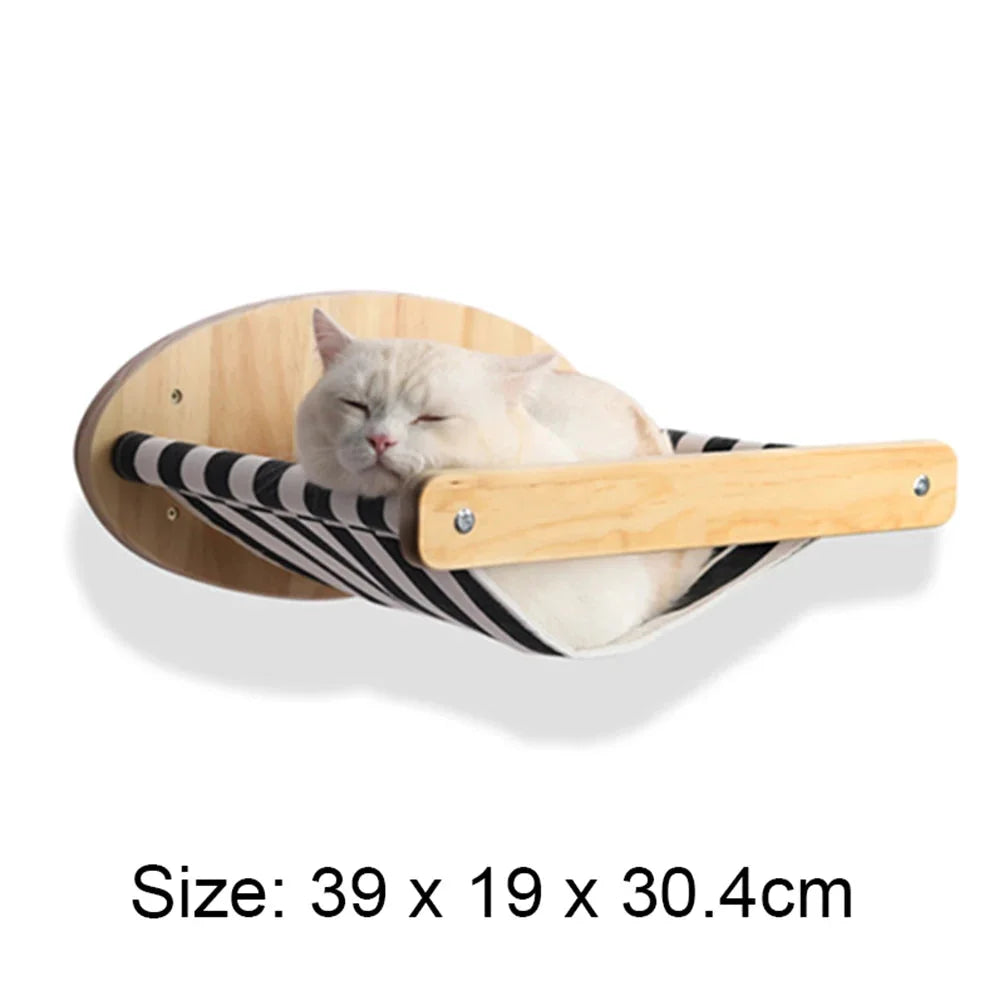 Wall-mounted cat hammock with wooden frame and striped fabric, perfect for resting and climbing.