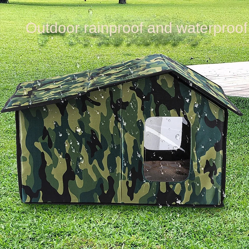 Camouflage outdoor cat shelter, rainproof and waterproof, placed on a grassy lawn.