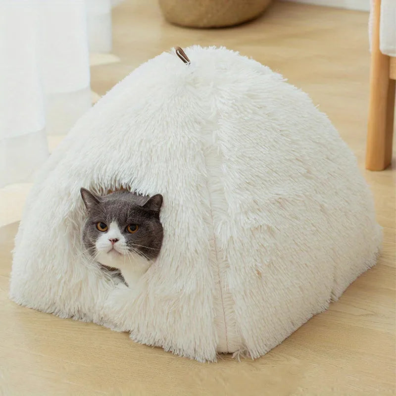 White cat heated bed with a cat comfortably sitting inside, designed for warmth and relaxation.